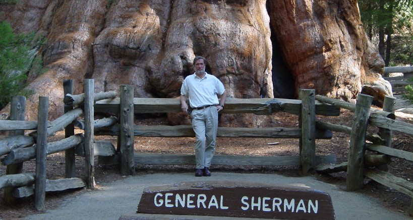 Andrew Rath at the base of the General Sherman redwood